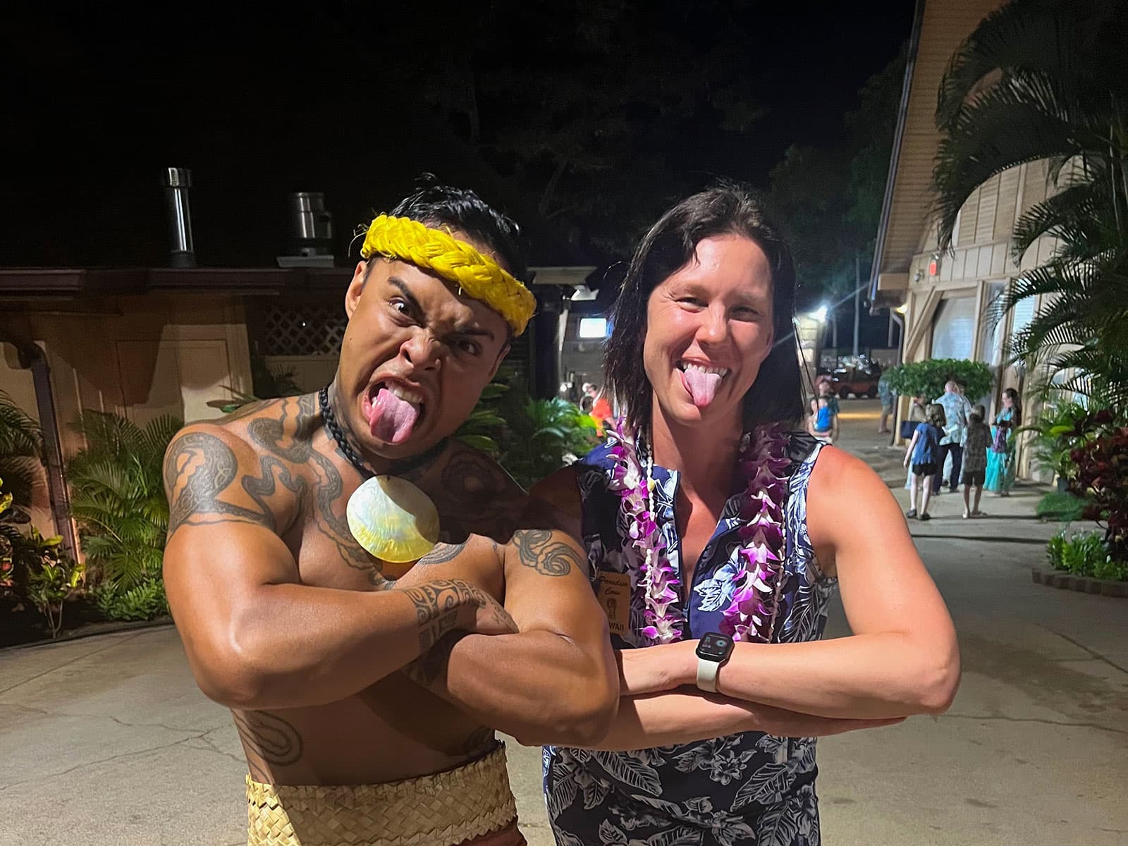 Jennifer posing with a Paradise Cove Luau performer