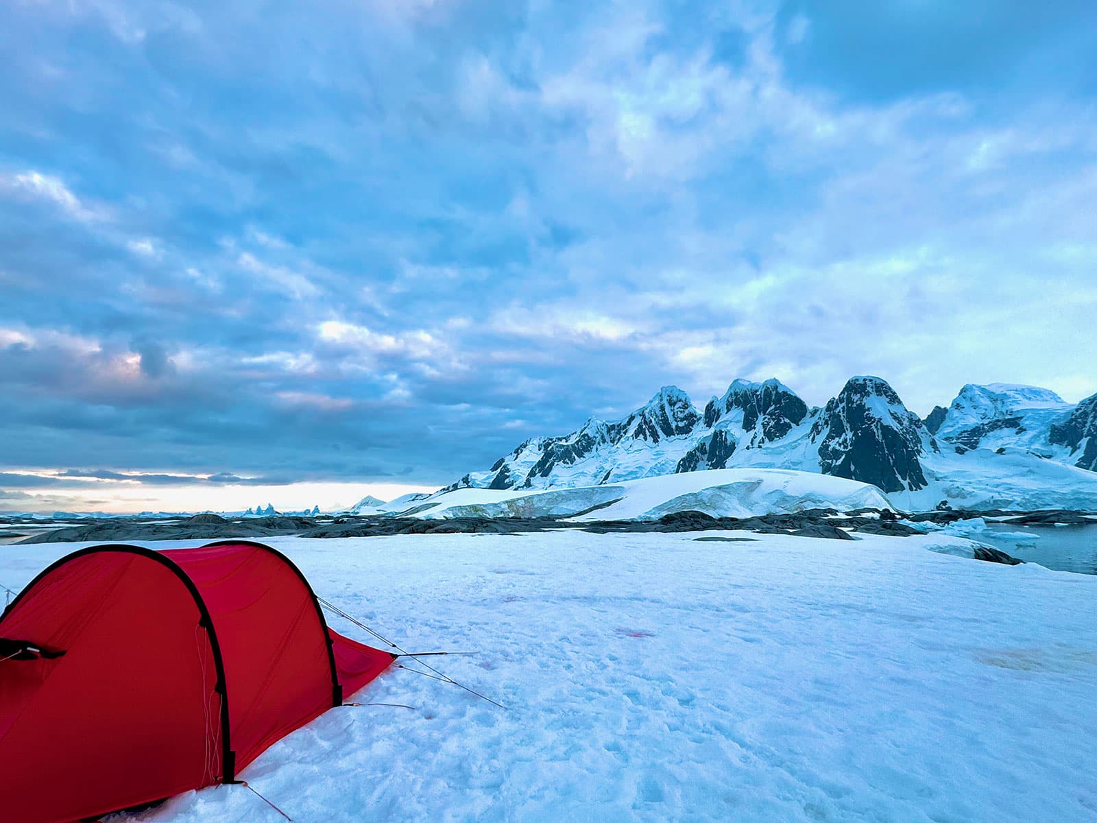 Red expedition tent on snow at Hovgaard Island