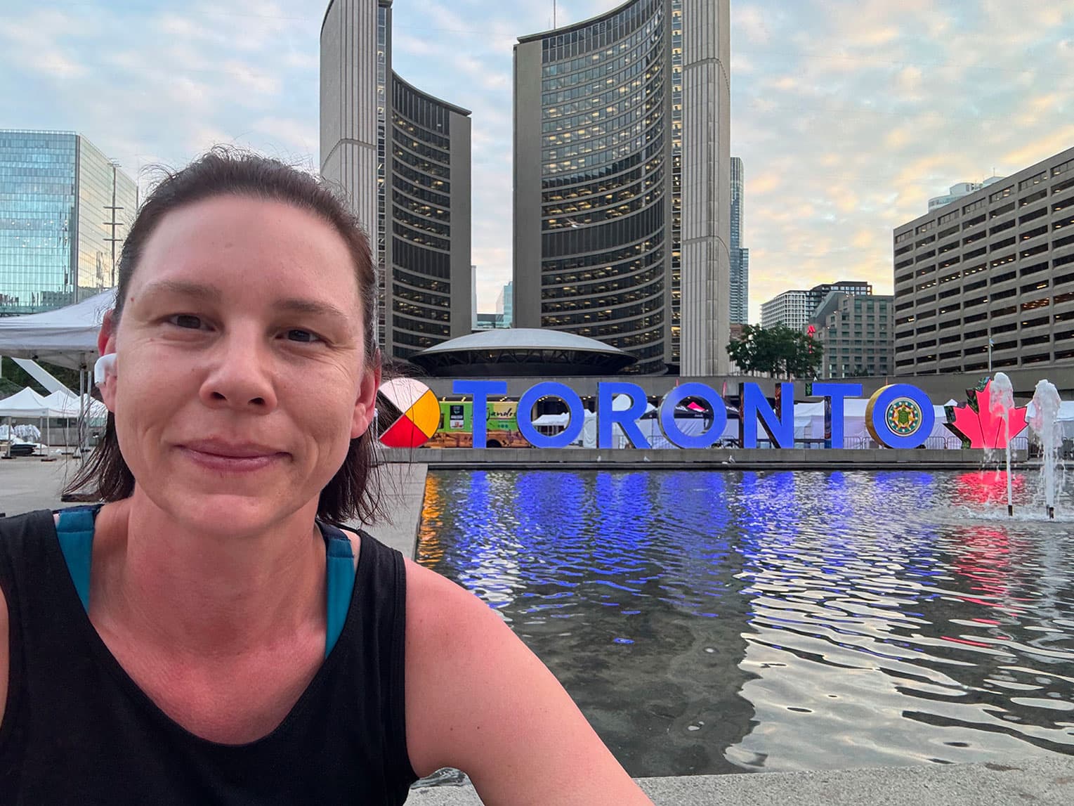 Jennifer at the Toronto sign in Nathan Phillips Square