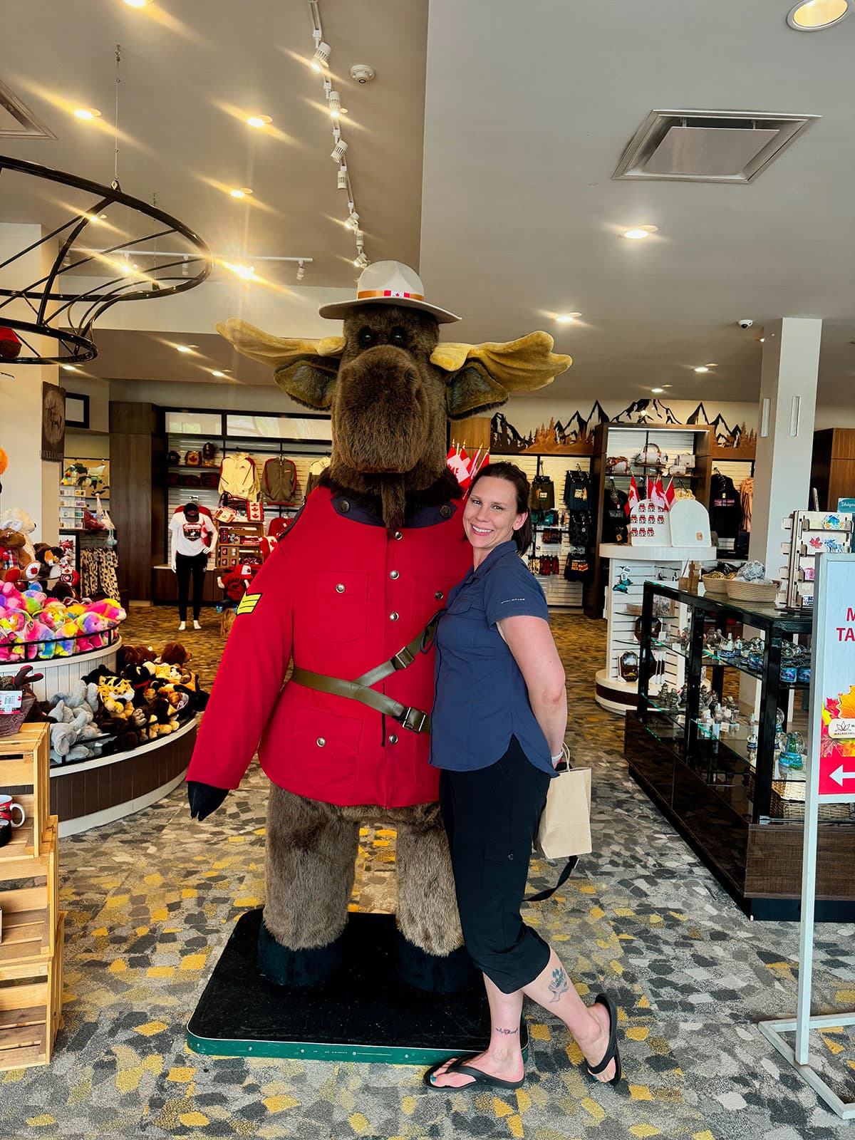 Jennifer posing with a Mountie moose display