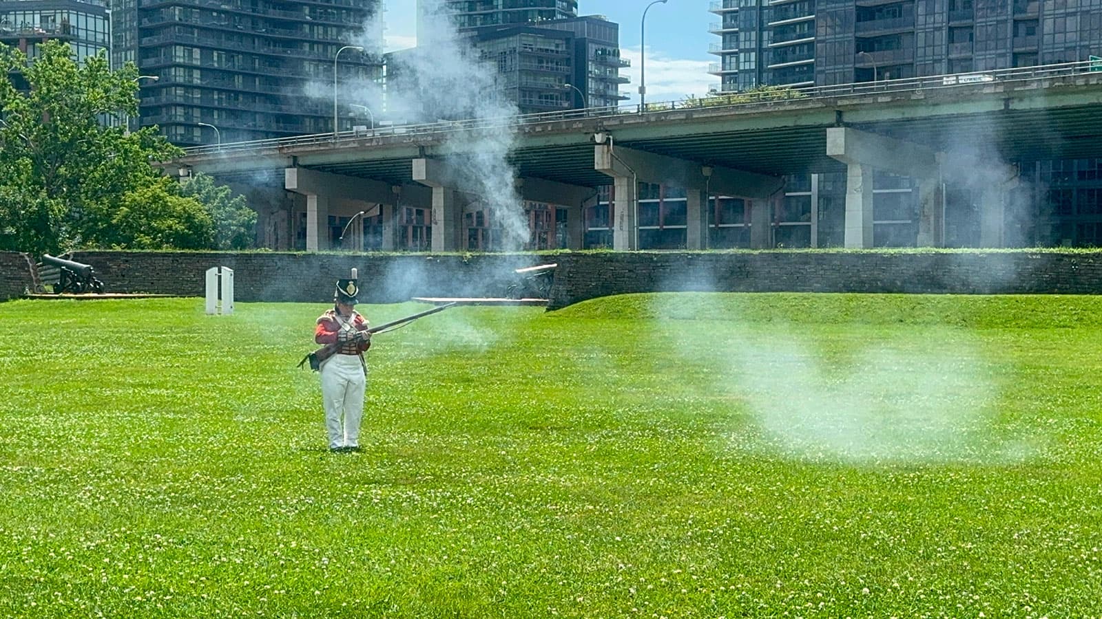 Fort York interpreter firing a musket