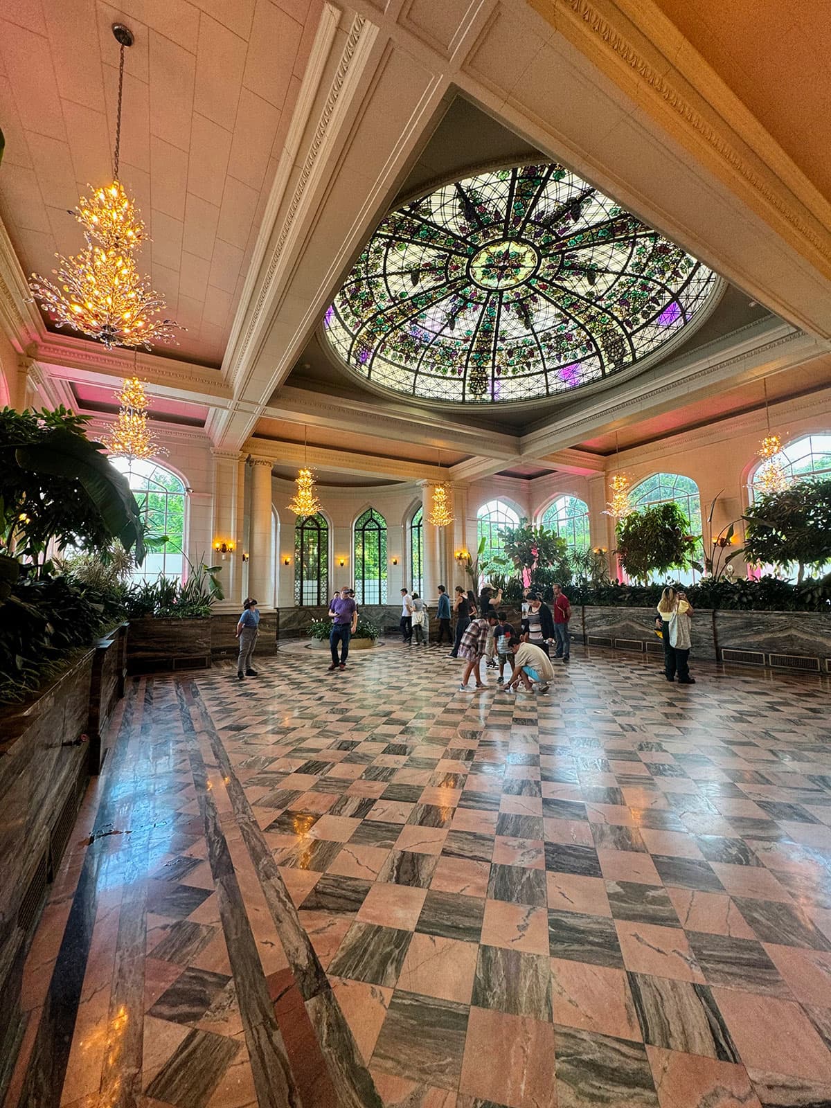 Casa Loma conservatory with stained-glass dome and marble floor