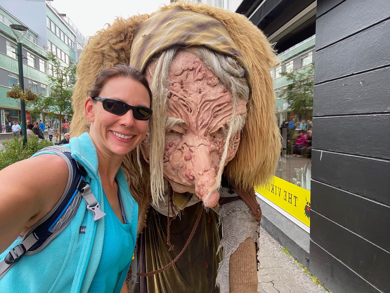 Jennifer posing beside an Icelandic troll figure
