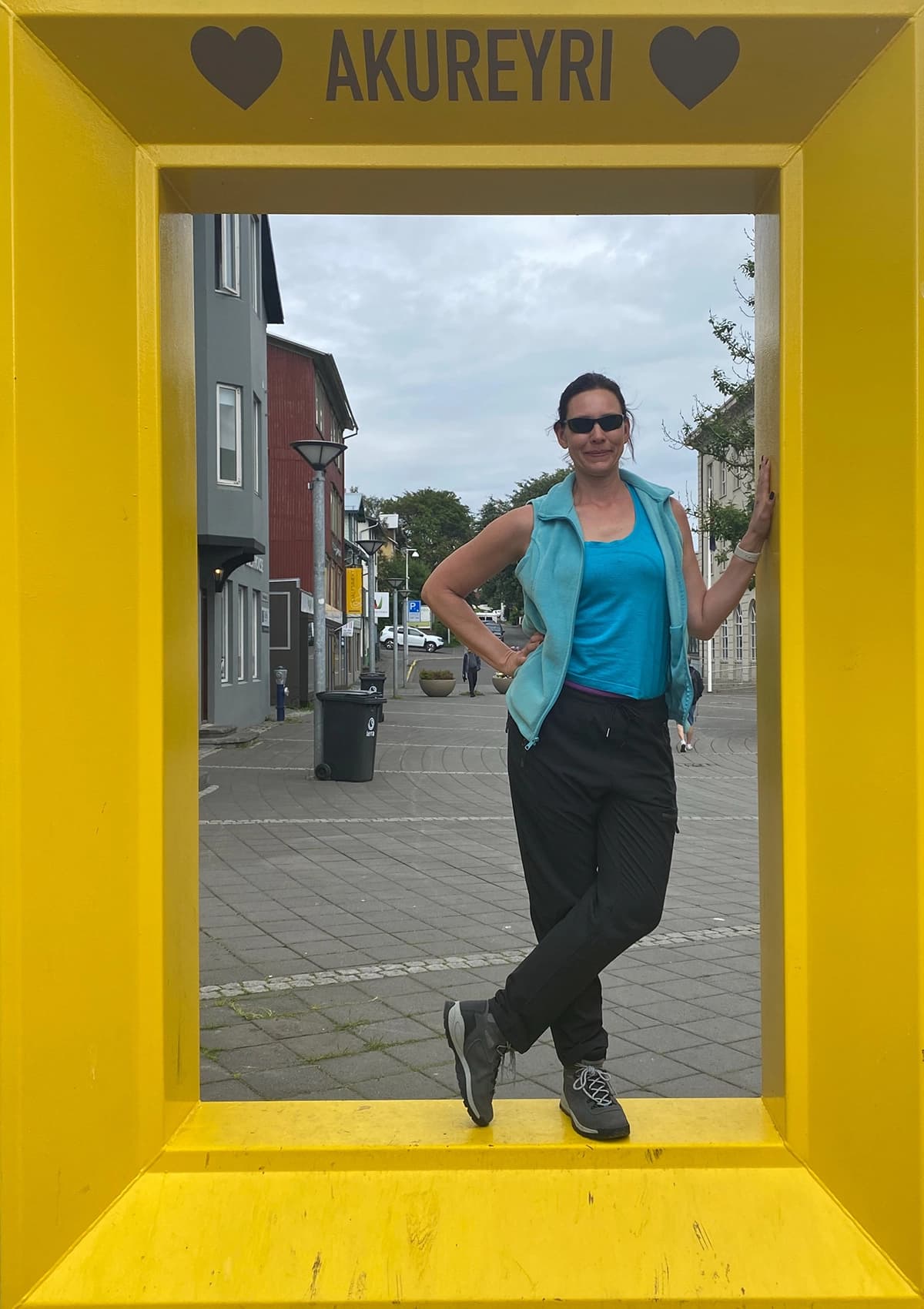 Jennifer standing inside a yellow Akureyri photo frame